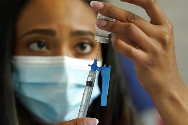 Fri. 9:51 a.m.: US expands COVID boosters to all adults, final hurdle ahead